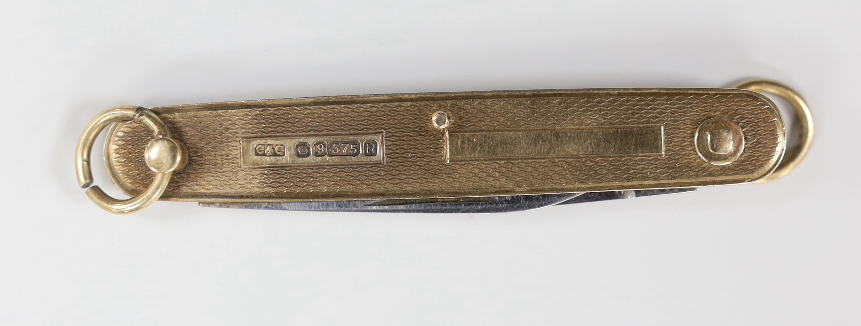 An engine turned 9ct gold cased penknife, 72mm.